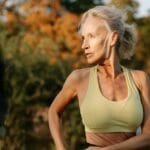 elderly-woman-in-sports-bra-practicing-yoga-outdoors-with-autumn-foliage-in-background.-6293247-scaled.jpg